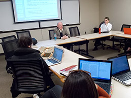 Donald Knebel shares many stories from his 39-year career with his students at Indiana University Maurer School of Law. He started teaching in 2011 at the invitation of his former colleague, Mark Janis (far right), director of the Center for Intellectual Property Research at IU Maurer. (IL Photo/ Marilyn Odendahl)